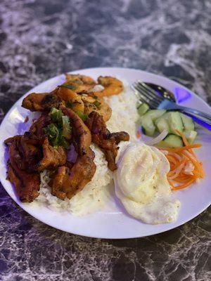 Chicken and rice plate with fried egg