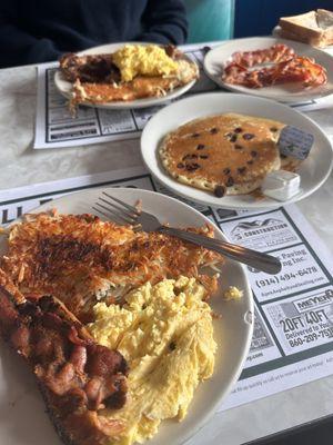 The Really hangry  -chocolate chip pancakes  -2 scrambled eggs -crispy hash browns  -2 stripes of bacon -1 sausage split into 2