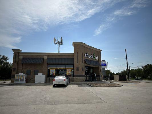 Front of store. Typical gas station with everything you need. There is a side that serves food.