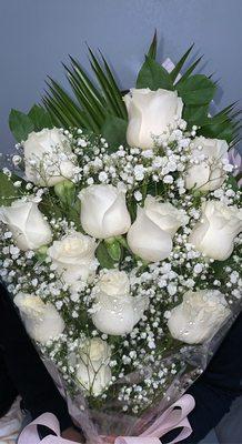 dozen white roses with baby's breathe,