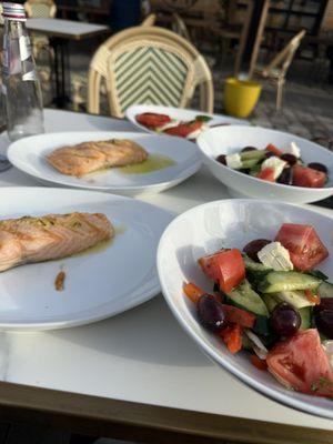 Greek salad, salmon and caprese salad