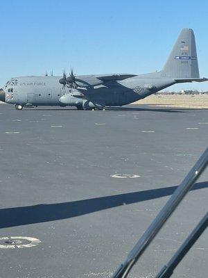 Military plane on the tarmac.