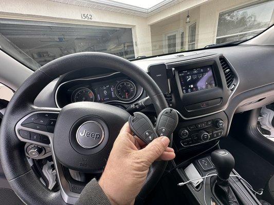 New key fobs for this Jeep in the villages Florida. We do car keys and programming. We also do residential keys and locks