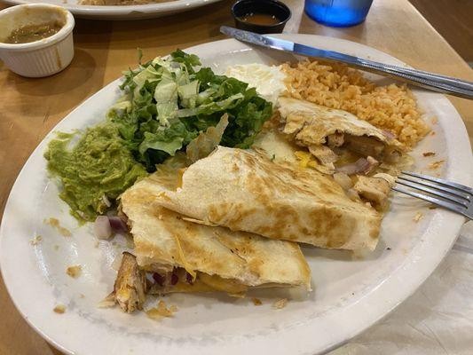 Chicken quesadilla with guacamole, sour cream, and rice (substituted for beans)