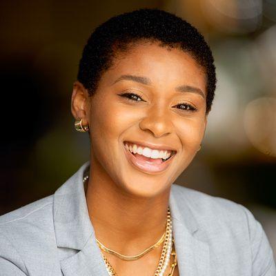 Business headshot of beautiful young African woman.