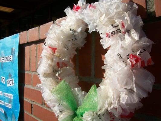 Holiday wreath made out of Von's plastic shopping bags on display in Pacific Beach for a Rise Above Plastics event.