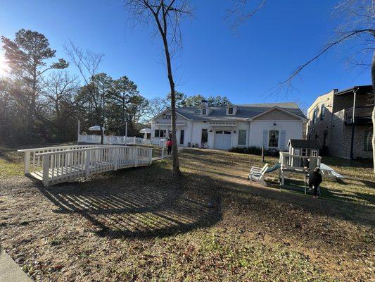 Outdoor seating, play area, and Book Exchange House right off the trailhead.