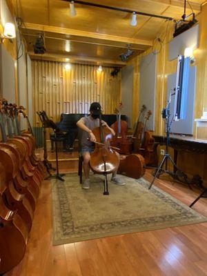 Doing a little bit of performance with his newly tuned cello!