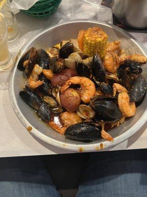 Combo meal with 1/2 Lb. Shrimp, 1/2 lb. Mussels, & 1/2 Lb. Clams. Butter Garlic sauce, medium hot.