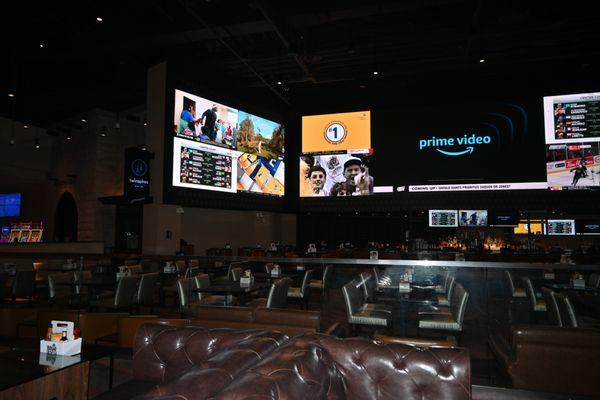 View of the TV's from the VIP couches at Twinspires Sportsbook