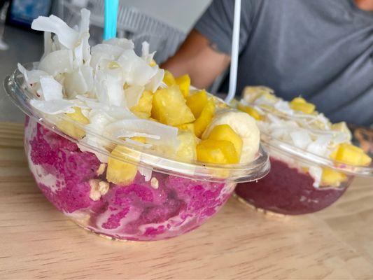 Pitaya bowl and Açaí bowl with banana, mango, pineapple, coconut, granola and honey.