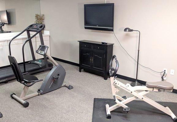 Small workout room on the second floor has some basic machines.