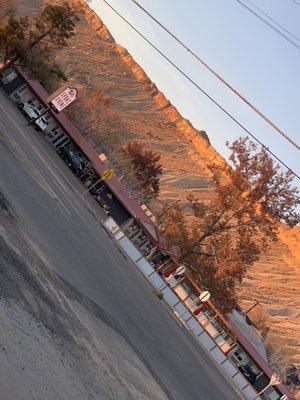 Having wine on the dec of Debeque canyon Winery across the street while enjoying the sun setting and view of the cutest motel!!