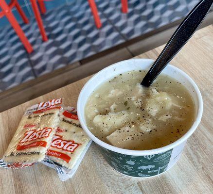 Cup of chicken and dumpling soup.