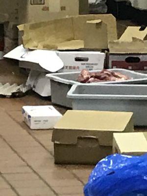 Why is there a box of meat sitting on the floor? Uncovered and Unrefrigerated!!! Won't get my money again....