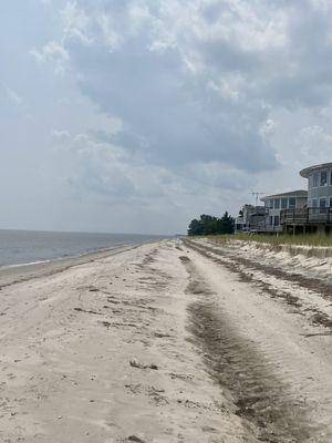 There are private homes all along the beach.