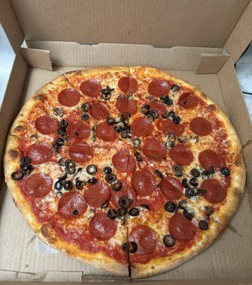 Large pepperoni pizza with black olives