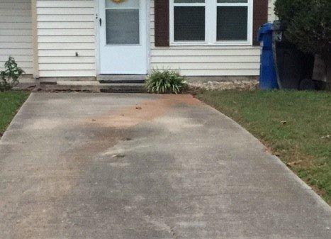 Rust from hot water heater drained in driveway