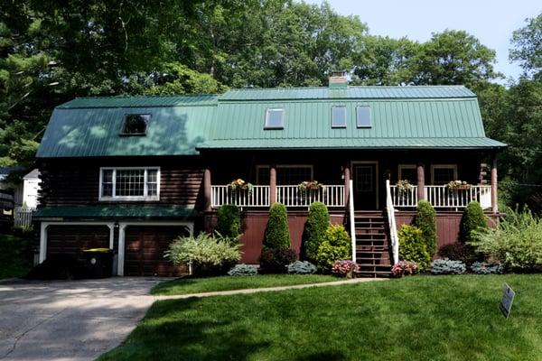 Who could have thought a barn style house could look any better? We added our "Evergreen" roof to put the cherry on top!