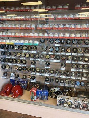 Hockey pucks and baseball memorabilia