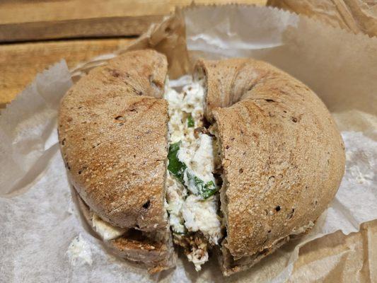 Blueberry bagel with bacon scallion spread