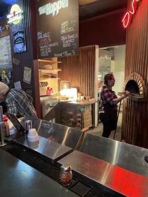 Pizza oven and staff at Hopper's