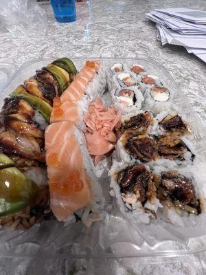 Assorted sushi - Highland roll, sunset roll, Philly roll, dragon roll