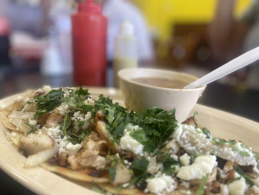 Chicken street tacos, cilantro, onion, avocado, lime & beans