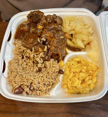 Oxtail with mac and cheese and cabbage