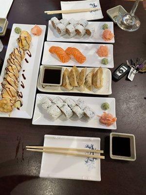 Gyoza, Salmon Sashimi, Tempura Philly roll, Spicy Tuna roll