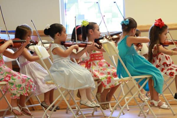 Kids Village Art Pre School end of the year violin performance.