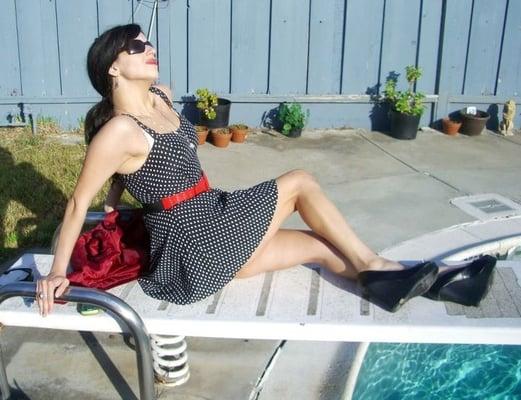 A CSUS Theatre-Starlet rests by the pool Hollywood-style