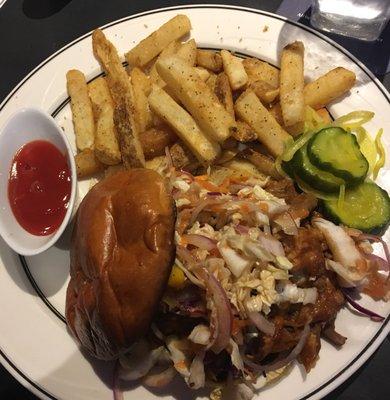 Pulled pork with coleslaw and fries.