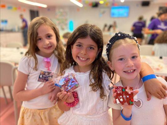 Girls who just made Glitter Tiles at Genius Gems NYC.