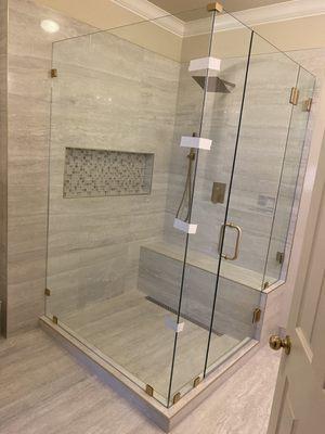 Completed installation of a frameless shower enclosure