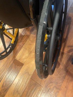 Wheels that have started to fall apart immediately after receiving it.  The dents are from the breaks cutting into the cheap plastic wheels