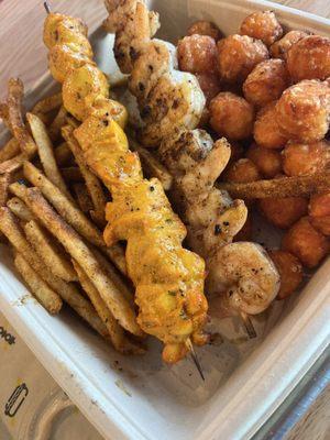 Chicken and Shrimp Kabobs with Cajun fries and sweet potato tots