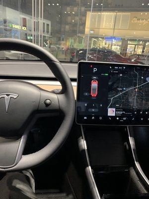 Interior of the showroom's Model 3 and the front door/window