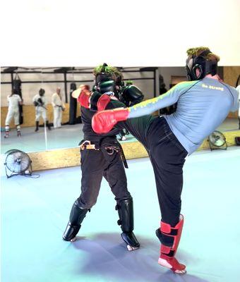 Intermediate level teens do more live sparring as they work towards a Black Belt in Freestyle Mixed Martial Arts.