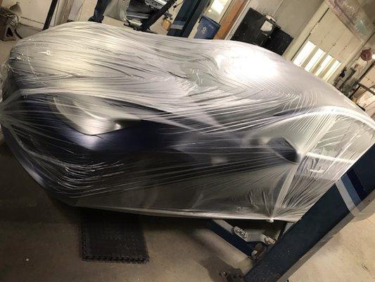 Tesla Model 3 wrapped and stored until rim work is completed