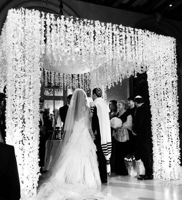 Our beautiful unique chuppah with hanging orchids. They hung all the string one by one.