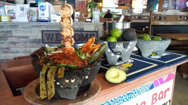 MOLCAJETE! STEAK, CHICKEN, SHRIMP, CHORIZO MARINATED IN OUR SPECIALS SEASONING, WITH COOKED CACTUS AND FRESH VEGGIES