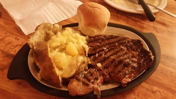 14oz Ribeye (half eaten) w/ baked potato