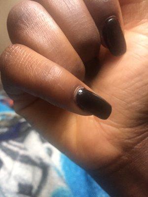 Repainted my nails black to draw less attention to this bullshit nail job. Here's where she cut me along my pinky finger with the nail file