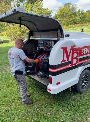 MB Plumbing sewer jetter being prepped to clear a line.