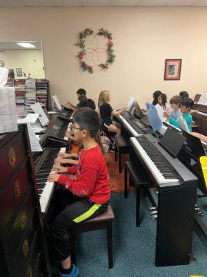 Elementary Ensemble rehearsal prepares for performance at Texas Music Teachers Conference.