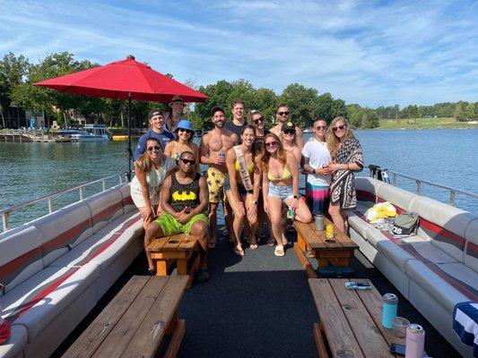 The boat was half shaded and half in the sun with a floating pad off the back