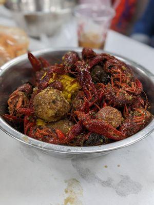 Seafood broils featuring crawfish, potatoes, corn, and shrimp