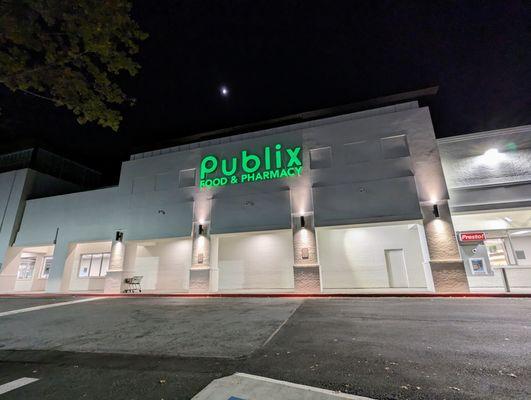 Outside at night. Storefront. Located in the Abernathy Square shopping center. 0.7x zoom.