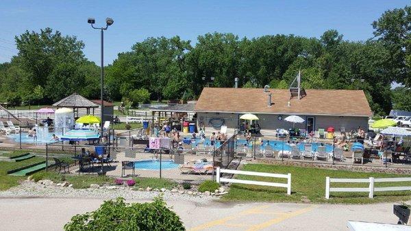 View of the refreshing pool, splash pad, hot, tub, and mini golf